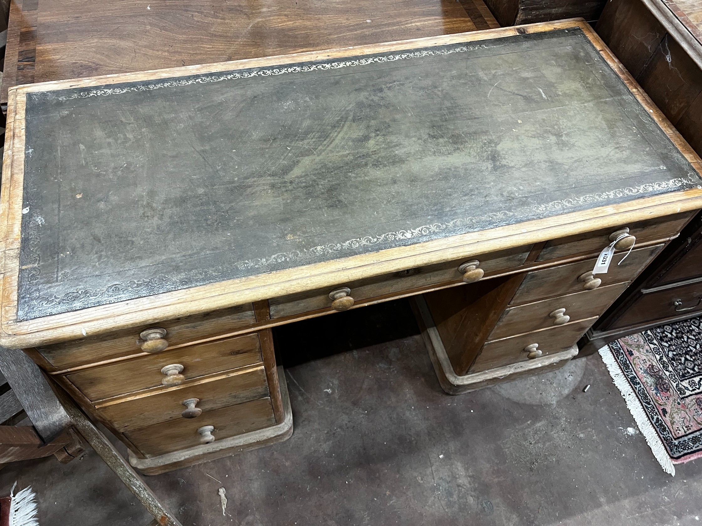 A Victorian pine kneehole desk, width 120cm depth 55cm height 77cm